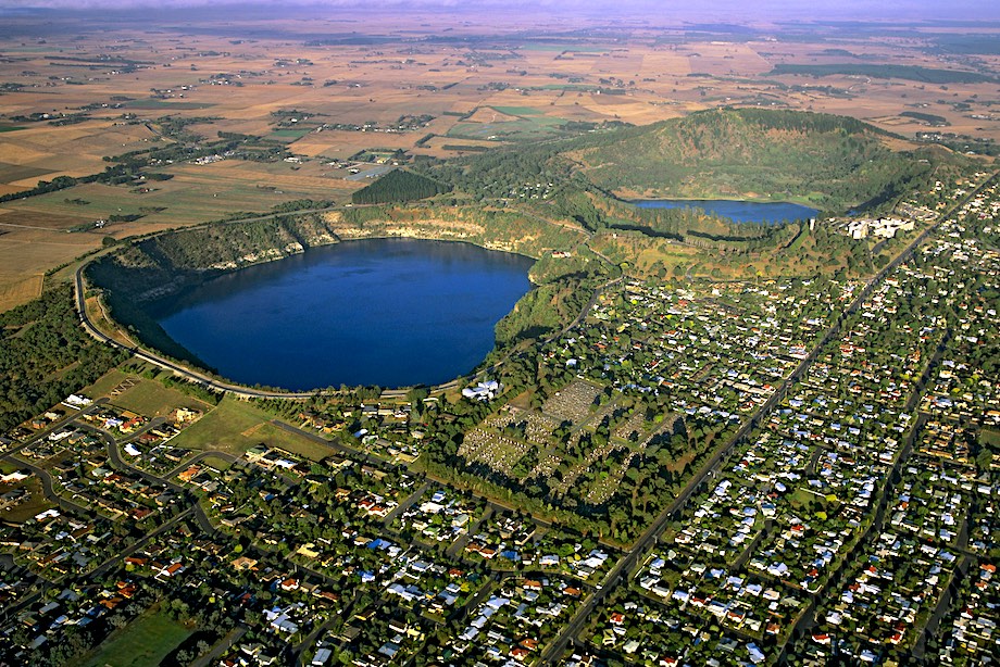 a aerial view of a lake surrounded by land
